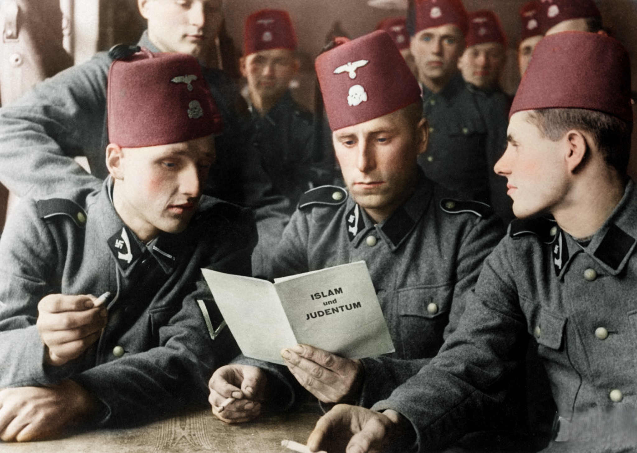 Bosnian SS soldiers with Nazi propaganda pamphlet